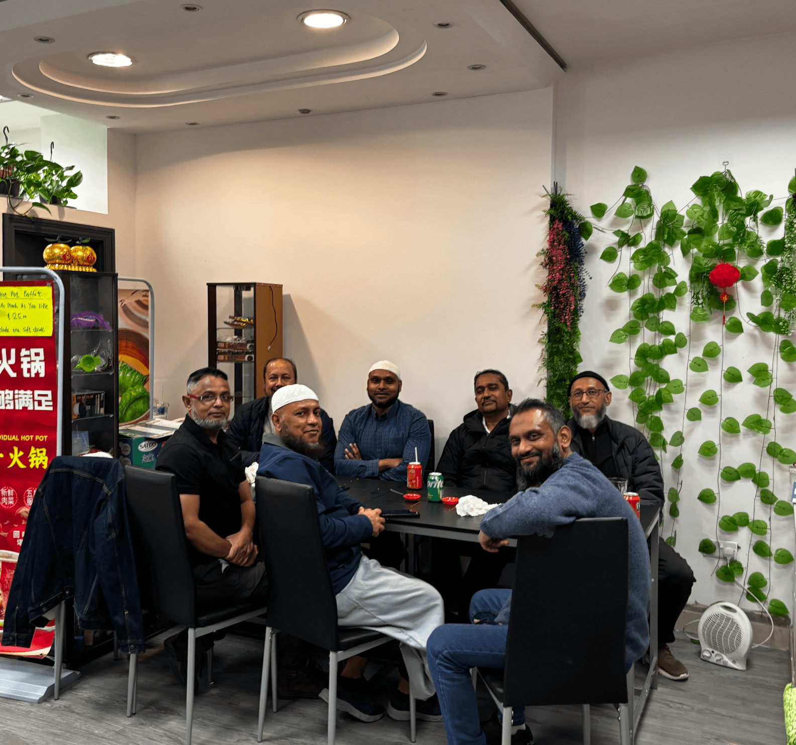 Group of friends sharing a halal Chinese meal at New Wok’s Cooking