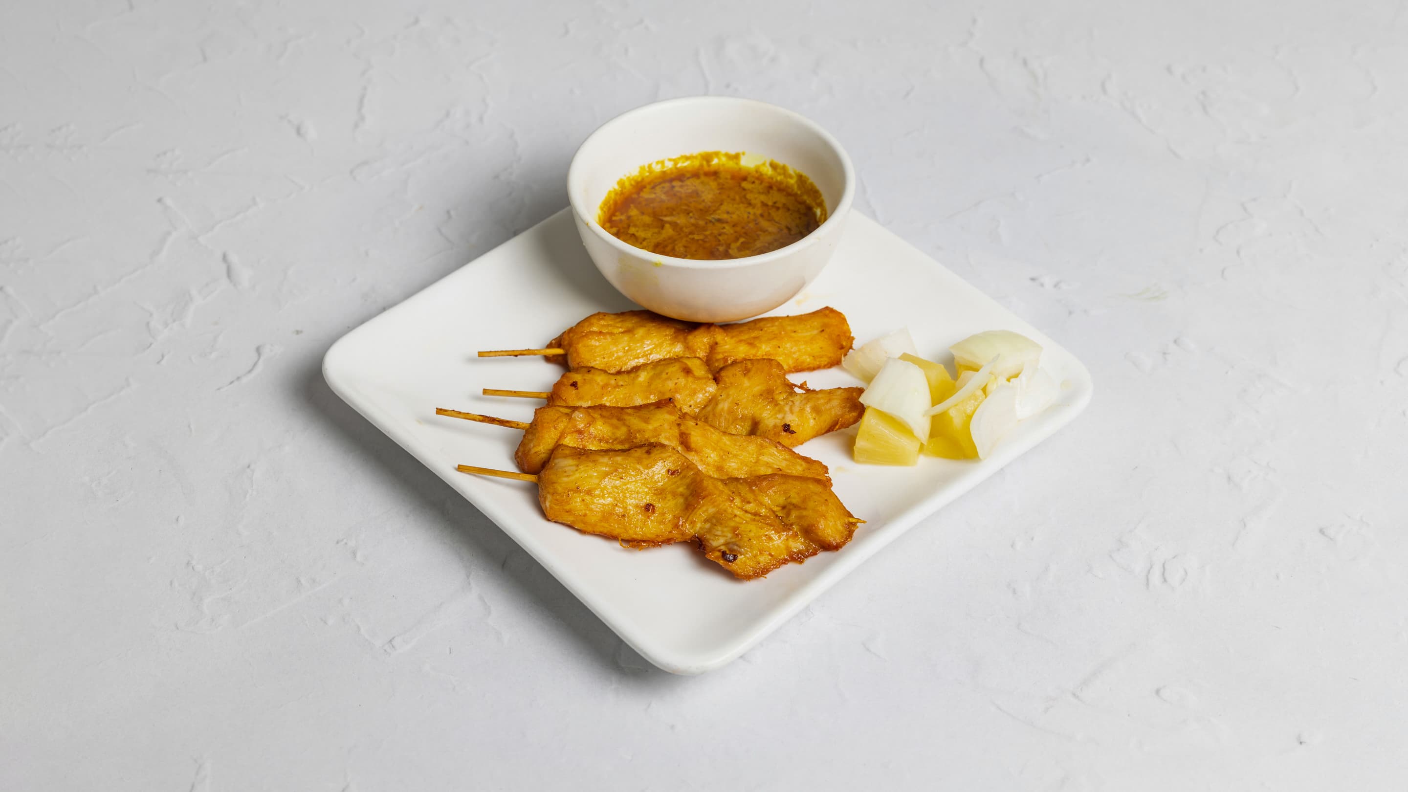 Satay chicken skewers at New Wok’s Cooking